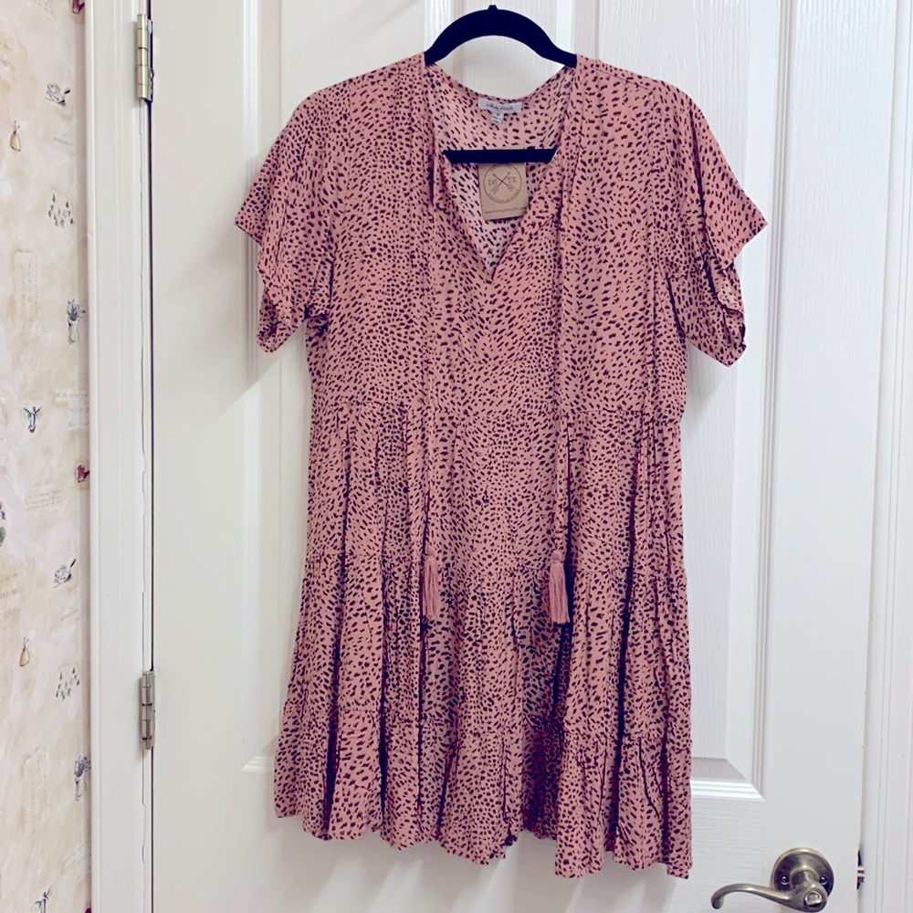 White birch animal print pattern, a v-neckline and a tiered ruffle hem size M